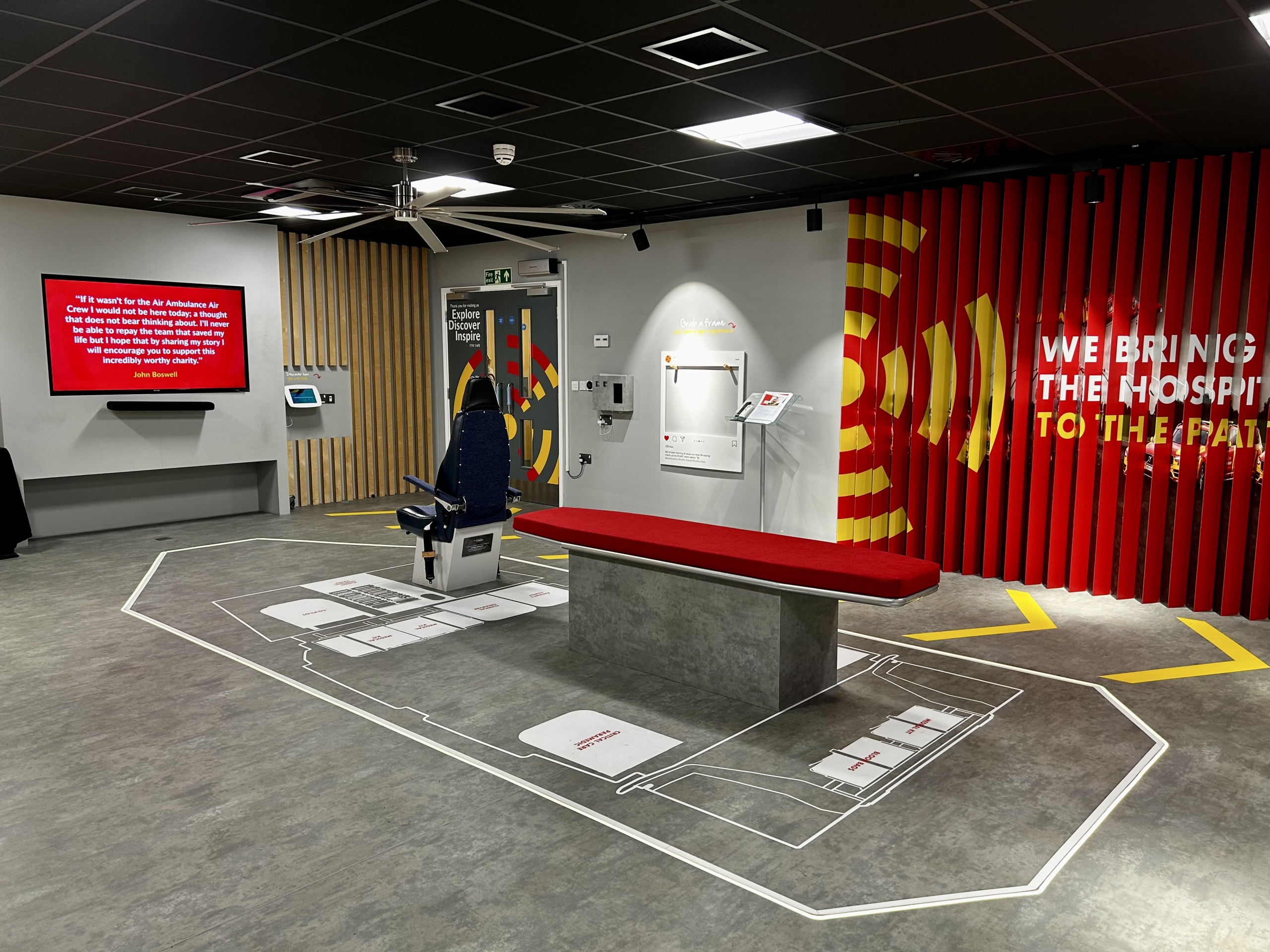 Helicopter chair and casualty table in the middle of a room