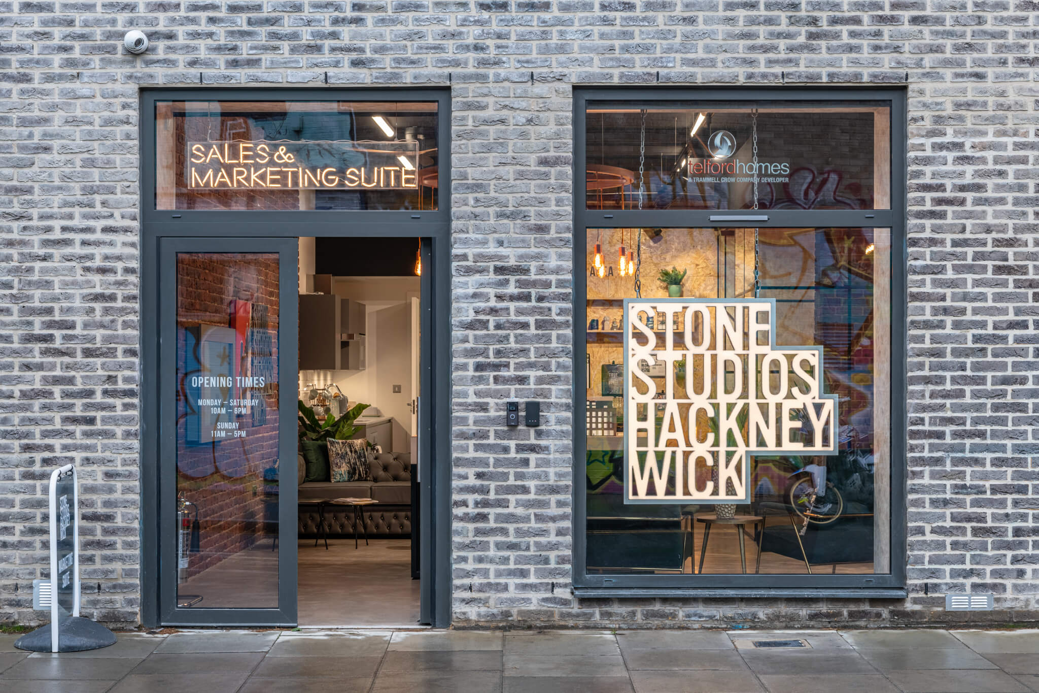 Brick building with a sign in the windows