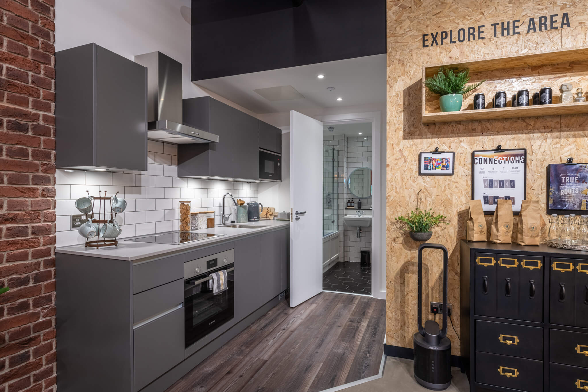 Modern Kitchen showroom with grey cabinets and white countertops