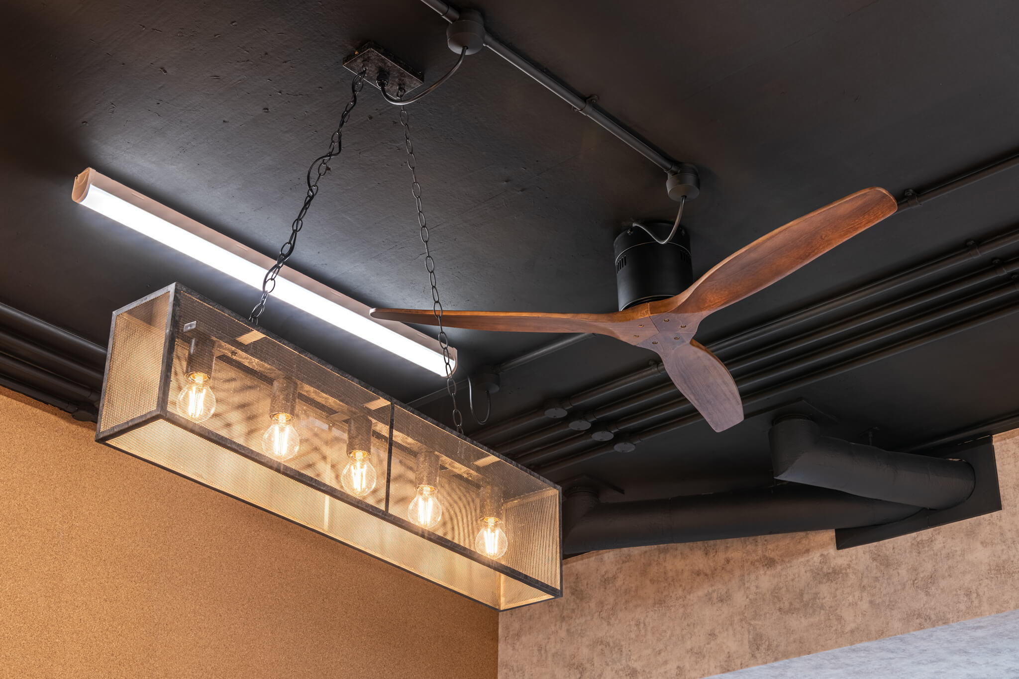 fan and a lamp both attached to the ceiling